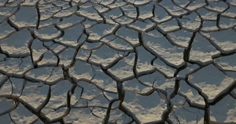 Climate change.Tilit-up close-up view of mud surface of a dry dam Video stock 155141646