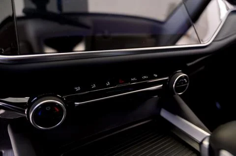 Climate control in a car. Temperature control buttons on a car air conditione Stock Photos