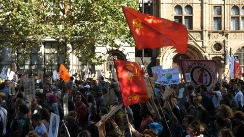 Climate Marching Protesters crowd with comunist party Flag Stock Footage 116390427