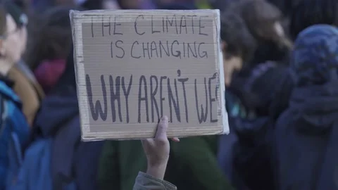 Climate Protest Sign The Climate is Changing Why Aren't We Vídeos de archivo 139249561