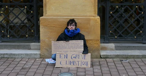 Climate protest by young french man: Grève climatique : "on strike for better" Stock Footage 103895787