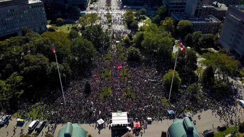 Climate strike protest crowd gathers at Legislature building, aerial Stock Footage 120350392