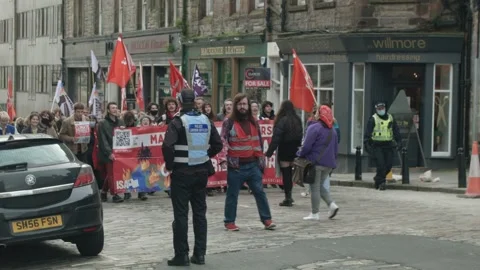 Climate Strikers Marching Down Road Holding Up Signs Stock Footage 164548723