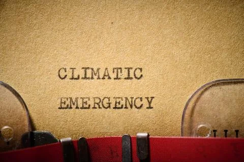 Climatic emergency text written with a typewriter Stock Photos