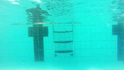 Climb the ladder into the pool Stock Footage 93067275
