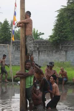 Climb slippery pole Stock Photos