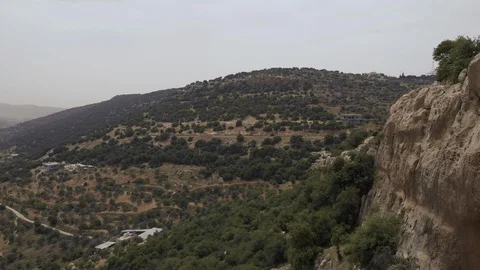 Climber absailing off cliff Stock Footage 122022517