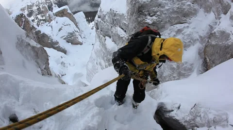 Climber abseiling back down using a double rope. Stock Footage 34448714