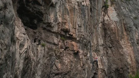Climber Advancing on the Rocks 4K Stock Footage 64185647