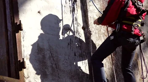 Climber builder renovating the old structure. Stock Footage