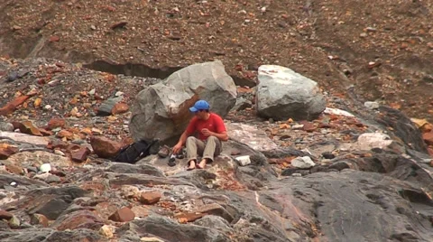 Climber Changing Boots In Nowhere HD Stock Footage 40715600