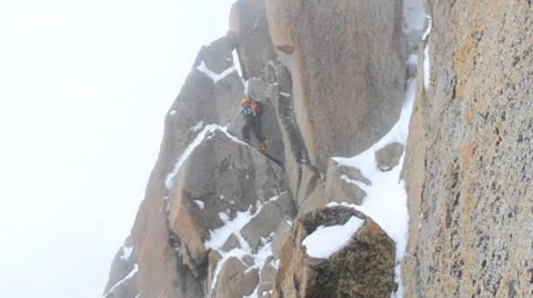 Climber climbing mountain wall 2 Stock Footage 24184826