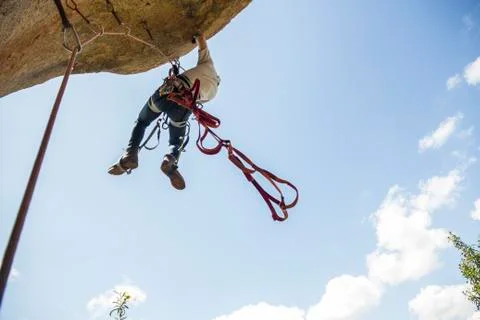 Climber climbing using aid climbing techniques Stock Photos