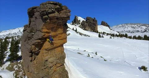 A climber conquers beautiful cliffs in winter and falls Video stock 115548058