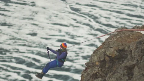 Climber crossing the gorge on a rope. Stock Footage 111032796