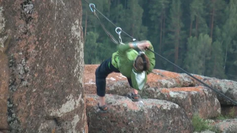 Climber crossing the mountain gorge. Stock Footage 86364094