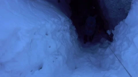 A climber descends into an ice cave. Video stock 149180808