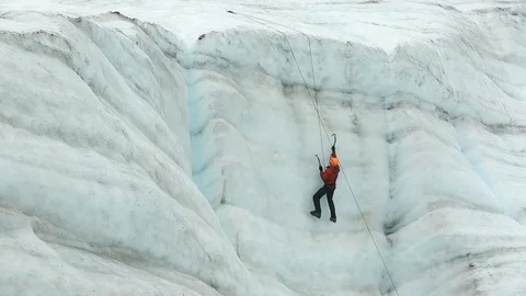Climber Digging Ice Picks into Glacial Ice Wall Alaska Stock Footage 121539998