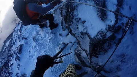 Climber down a cliff on a rope Stock Footage 115840678