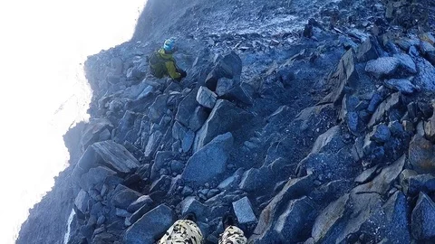 Climber down a cliff on a rope Stock Footage 115840721