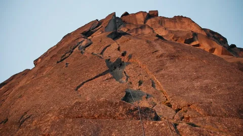 Climber down the mountain on a rope. Stock Footage 92610205