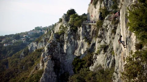 Climber Down The Mountain On A Rope, wideangle Stock Footage 120899194