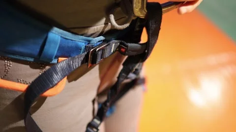 Climber fastens a safety harness. Stock Footage 339287770