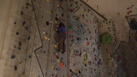 Climber focuses while moving up Stock Footage 339287863