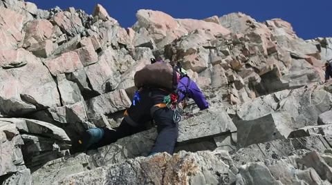 Climber going up rock face Stock Footage 55539449