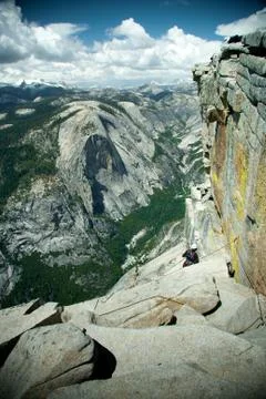 Climber on the half dome Stock Photos