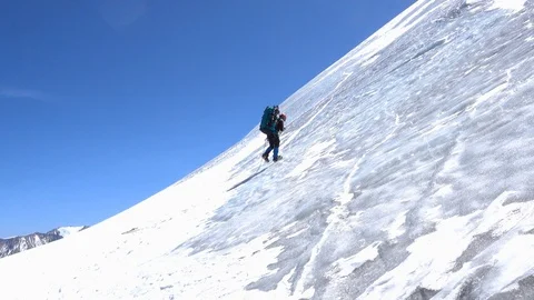 Climber on the ice slope Видео 97003134