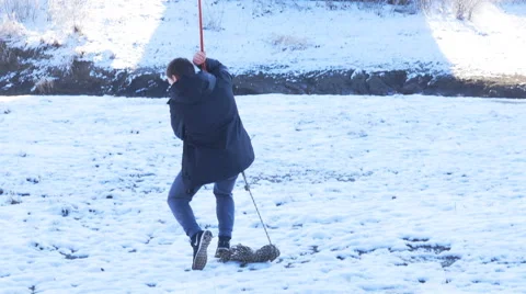 Climber lands on snow-covered surface Stock Footage 60442091