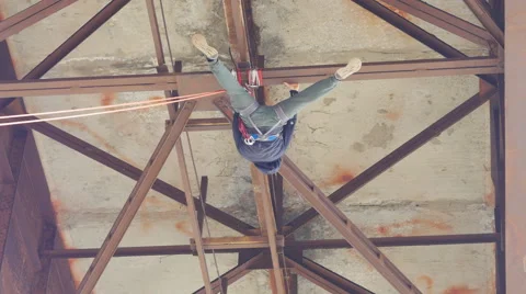 Climber makes manipulation and exercise, hovering on the rope Stock Footage 60442838