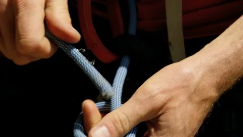 Climber making safety node Mt Habrich British Columbia Stock Footage 80044154