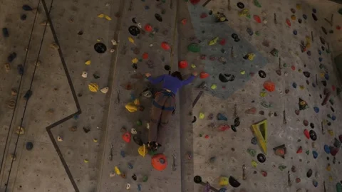 Climber moves up route from behind Stock Footage 339287853