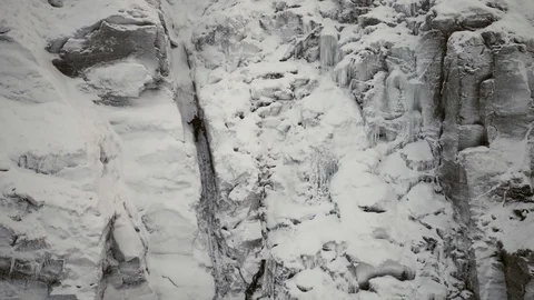 Climber moving up icy gully. Drone shot. 4K Stock Footage 90096970