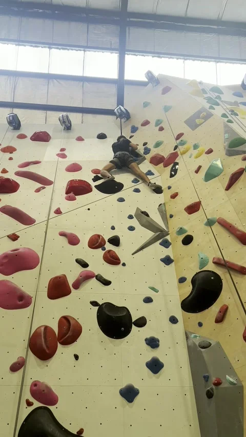 Climber nearing the top of the wall Stock Footage 345829313
