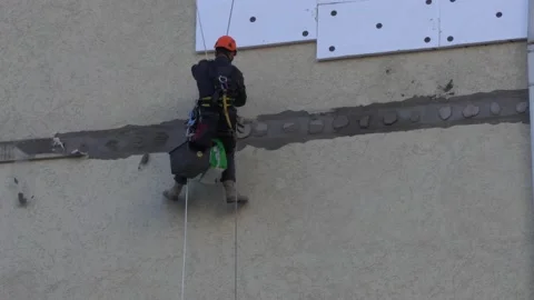 Climber performs construction work Stock Footage 228794592