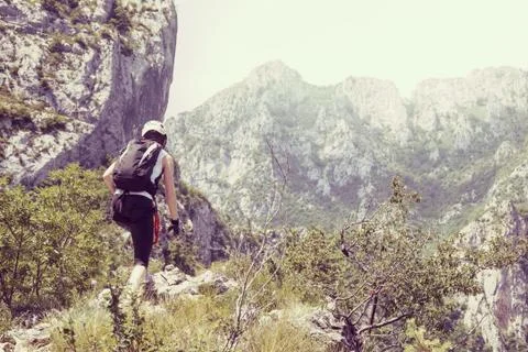 Climber performs at top of mountain Stock Photos