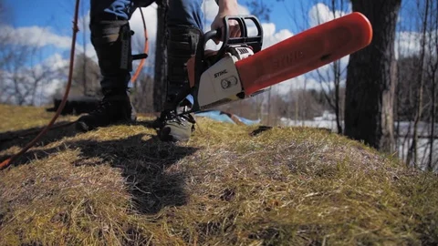 Climber picks up a chainsaw Stock Footage 97358748