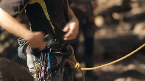 Climber preparing equipment before climbing to the top. Stock Footage 85135364