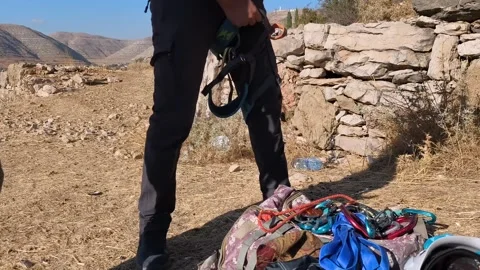 Climber Preparing Gear Outdoors Stock Footage 346153874