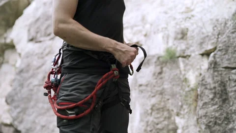 Climber preparing for rock climb Stock Footage 152556719
