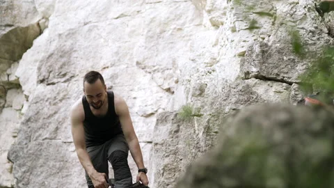 Climber preparing for rock climb Video stock 152557190