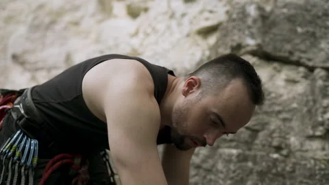 Climber preparing for rock climb Video stock 152557644