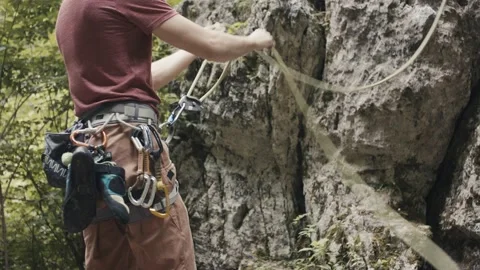 Climber protect his partner pull rope safety gear Stock Footage 134192048