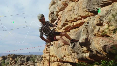 Climber pulling rope to rappel, rappelling rock face with dashed red marking Stock Footage 334000114