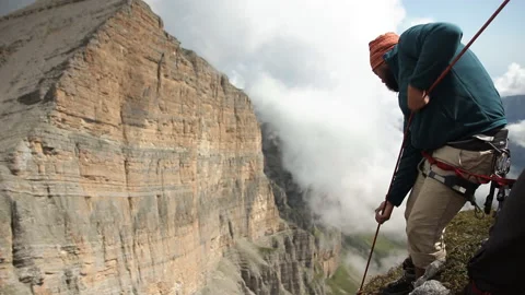 Climber pulls a rope in the mountains. Rescue operations in the mountains. Stock Footage 97765450