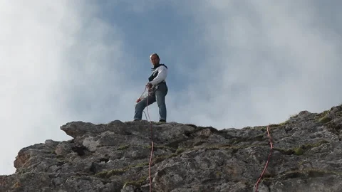 Climber pulls a rope in the mountains. Rescue operations in the mountains. Stock Footage 97768064