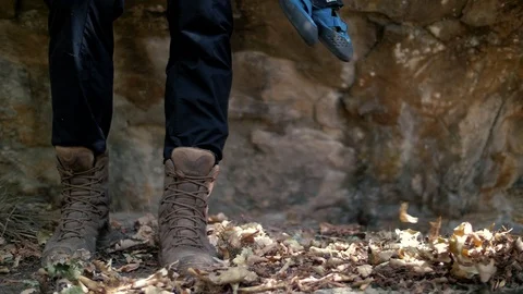 The climber puts on rock shoes for the route Video stock 102652989